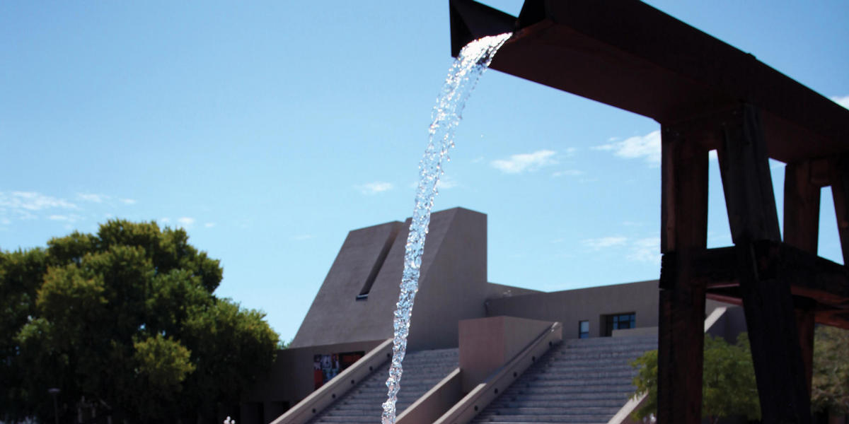 Exterior of Hispanic Cultural Center with fountain sculpture