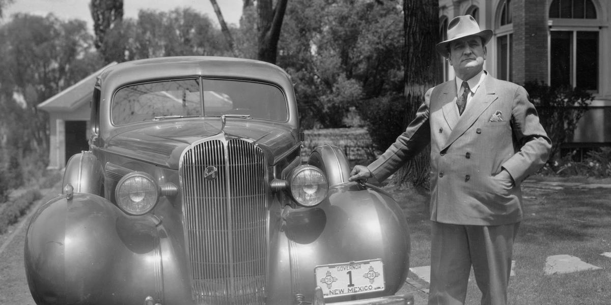 Clyde Tingley standing next to car