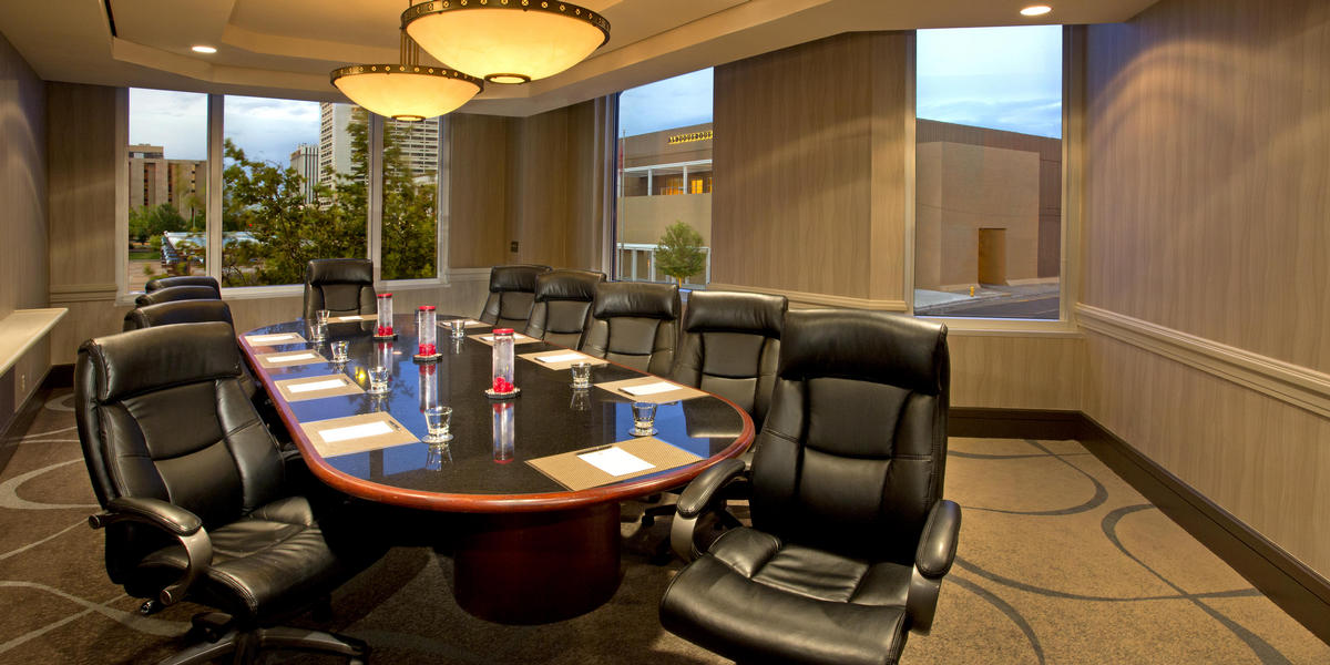Boardroom table and chairs set up for meeting