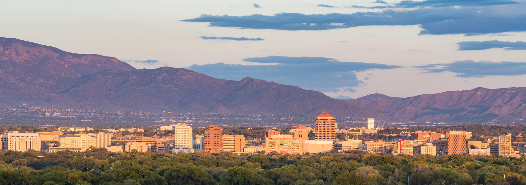 Panoramic view of downtown Albuquerque with mountains in background